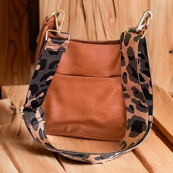 ADORNED LEATHER MESSENGER CROSSBODY with Cheetah Removable Guitar Strap in Tan - Picture 1 of 5